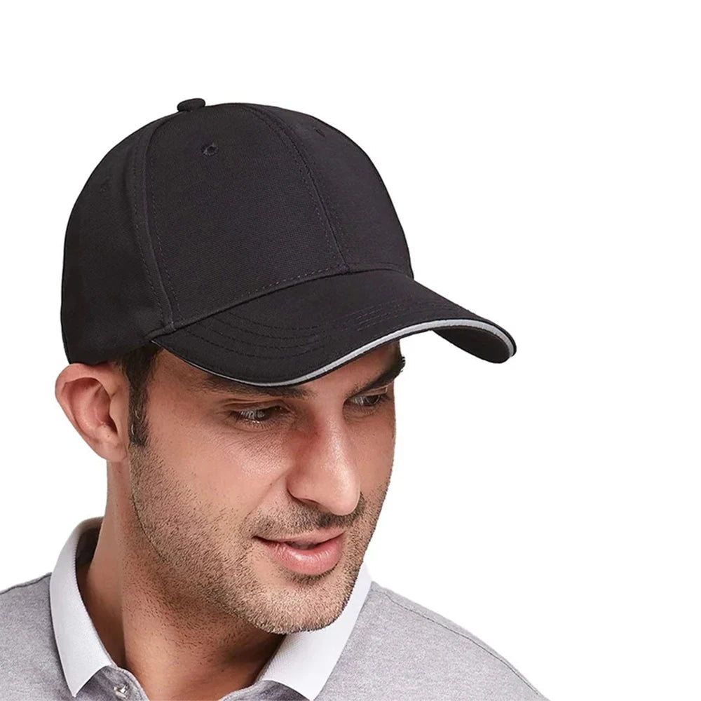 Man wearing a black LED light therapy cap, with close-up of red light inside hat