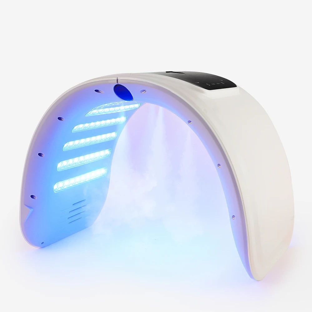 LED light therapy device with blue lights and mist for skincare on white background